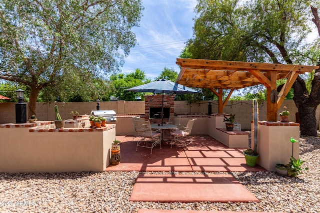 view of patio / terrace with area for grilling, a grill, fence, and outdoor dining area