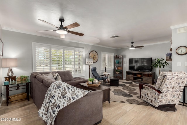 living area with ceiling fan, wood finished floors, and ornamental molding