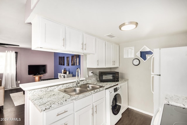 kitchen with white cabinetry, sink, dark wood-type flooring, white refrigerator, and washer / clothes dryer