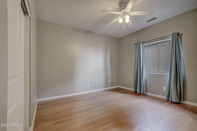 spare room with light hardwood / wood-style flooring and ceiling fan