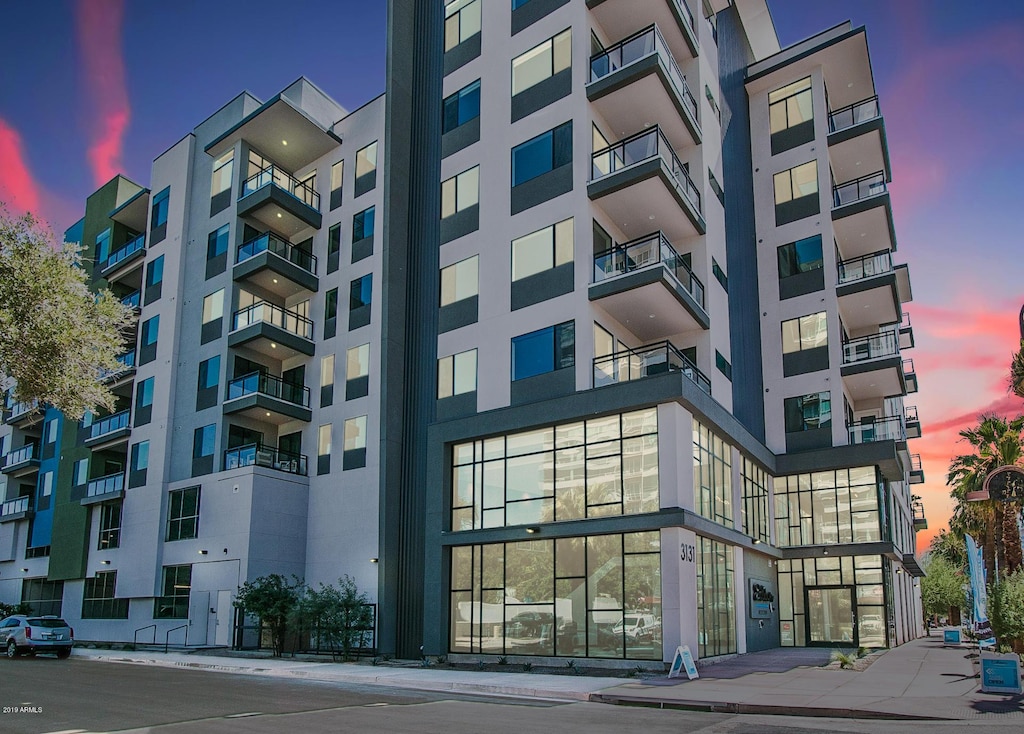 view of outdoor building at dusk