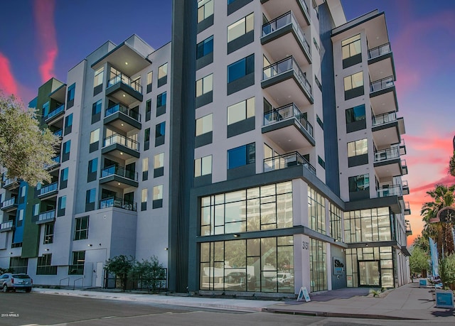 view of outdoor building at dusk