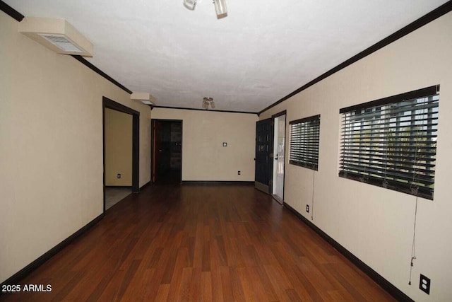 corridor featuring ornamental molding and dark hardwood / wood-style floors