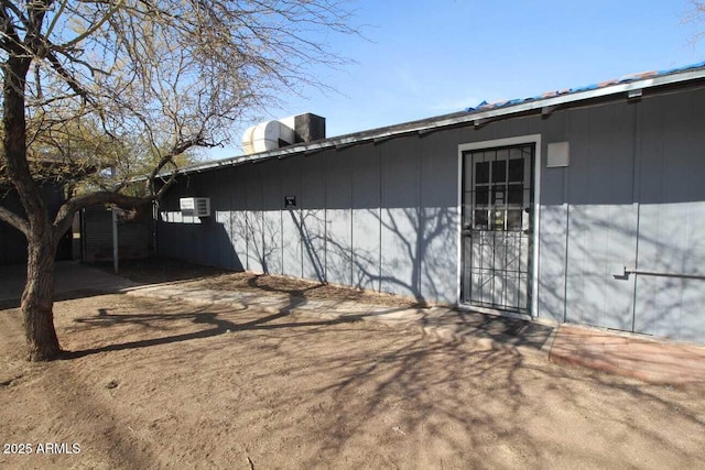 back of house featuring central AC