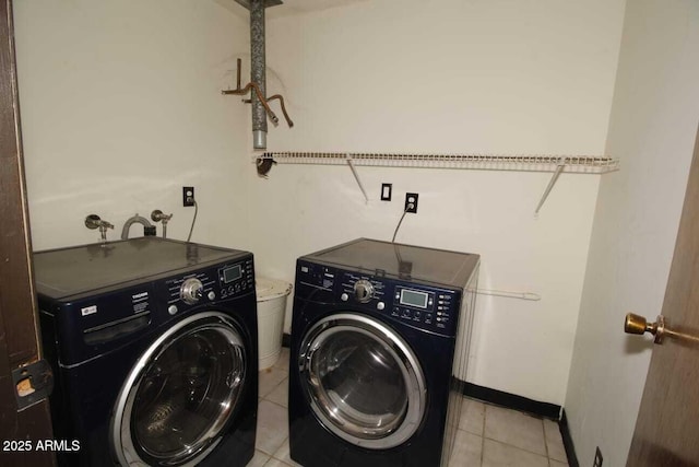 washroom with light tile patterned flooring and independent washer and dryer