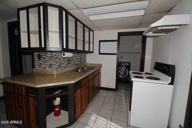 kitchen featuring white electric range, washer / clothes dryer, sink, backsplash, and dark brown cabinetry