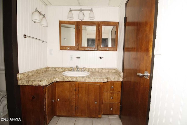 bathroom with vanity and tile patterned flooring