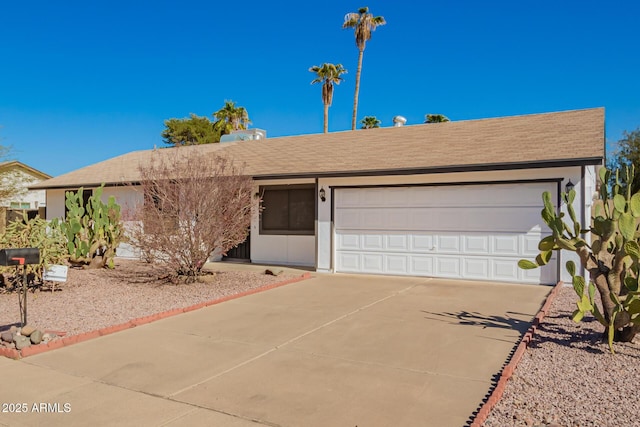 single story home with an attached garage and concrete driveway