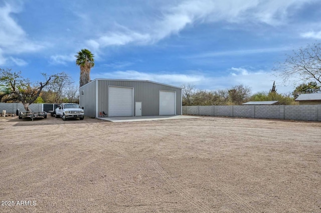 exterior space with fence and an outdoor structure