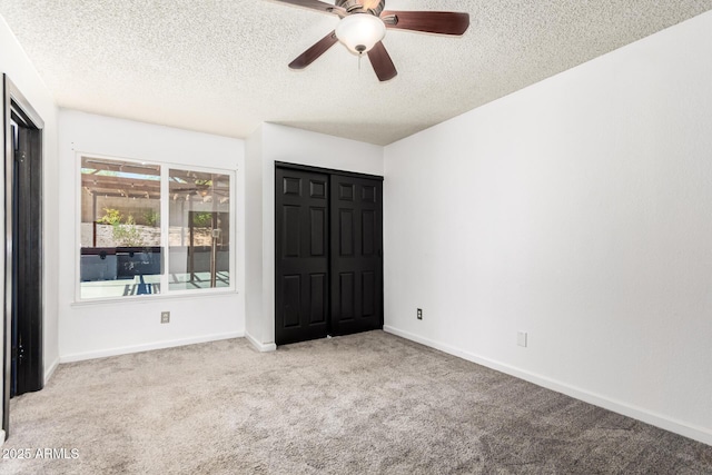 2109 E Gelding Dr, Phoenix, AZ 85022 - unfurnished bedroom with carpet flooring, a textured ceiling, and ceiling fan
