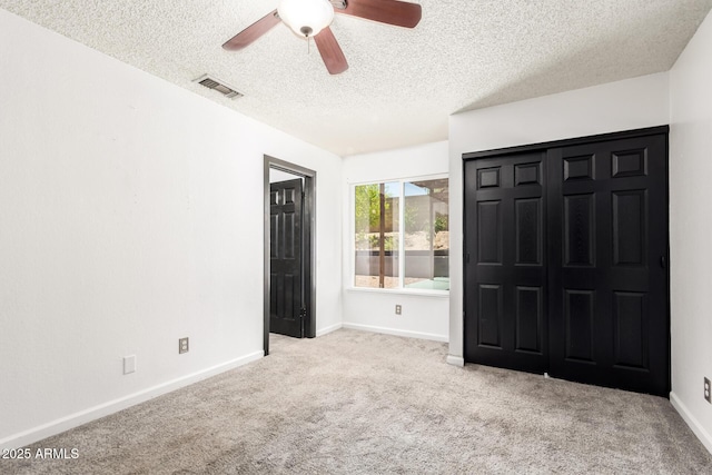 2109 E Gelding Dr, Phoenix, AZ 85022 - unfurnished bedroom featuring carpet flooring, a textured ceiling, and a ceiling fan
