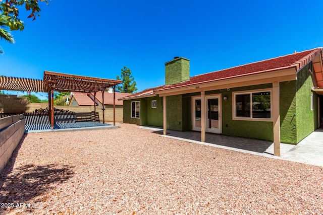 2109 E Gelding Dr, Phoenix, AZ 85022 - rear view of property with a chimney, a pergola, a patio, and stucco siding