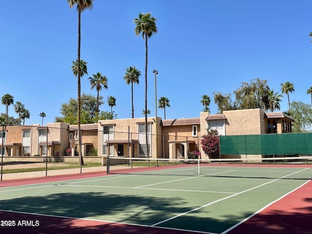 view of sport court with community basketball court, a residential view, and fence