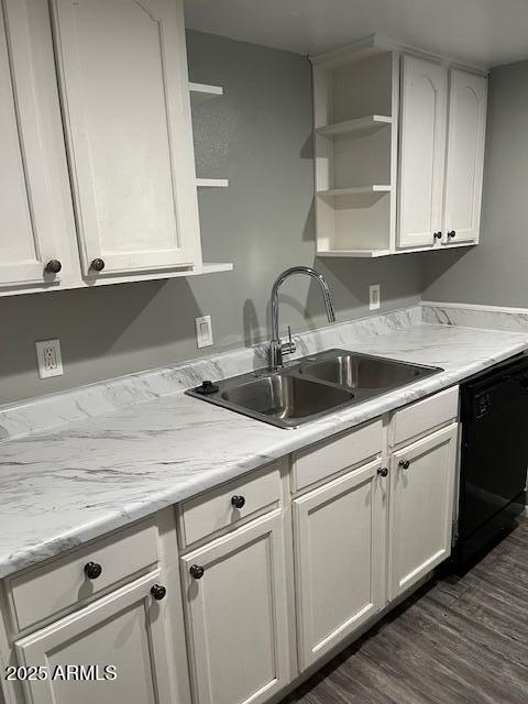 kitchen with dishwasher, open shelves, a sink, and white cabinetry