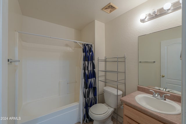 full bathroom with vanity, shower / bath combination with curtain, and toilet