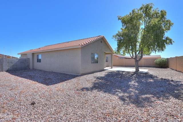 view of side of property featuring a patio