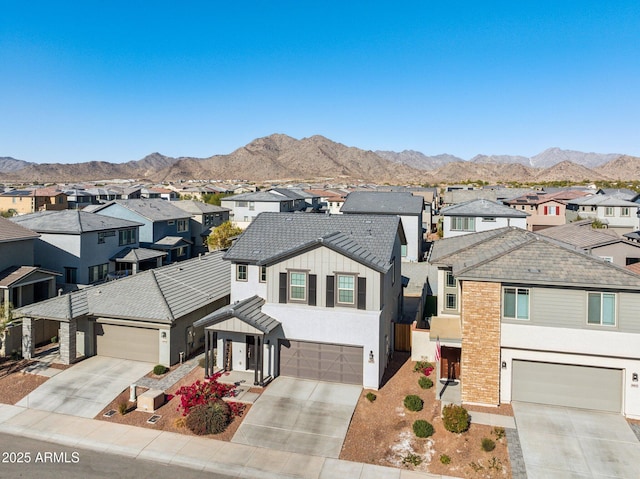 view of front of house with a mountain view and a garage