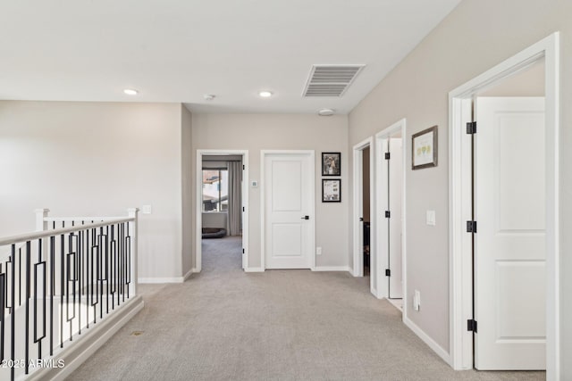 corridor with light carpet