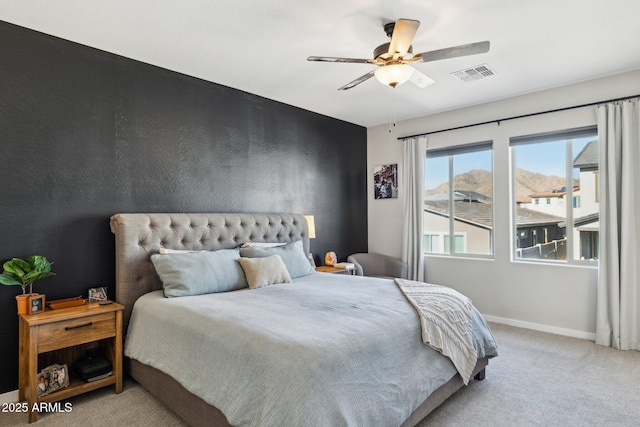 bedroom with light carpet and ceiling fan