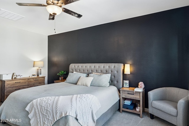 carpeted bedroom with ceiling fan