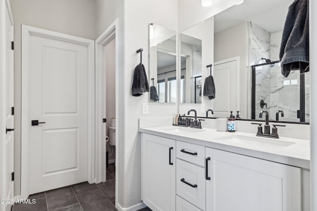 bathroom with tile patterned floors, walk in shower, toilet, and vanity