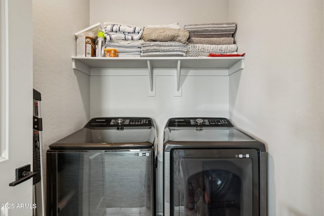 laundry room with washer and clothes dryer