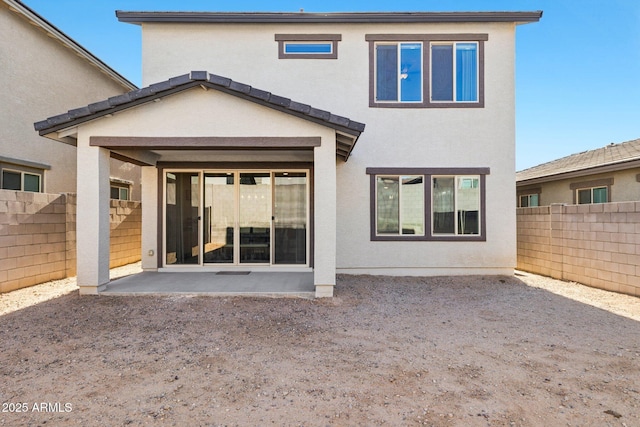 rear view of property featuring a patio area