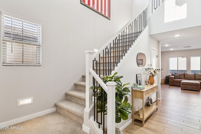 staircase featuring hardwood / wood-style flooring