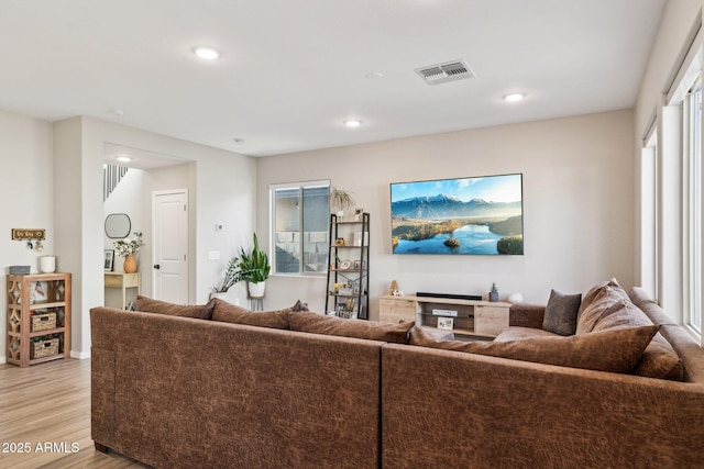 living room with light hardwood / wood-style flooring