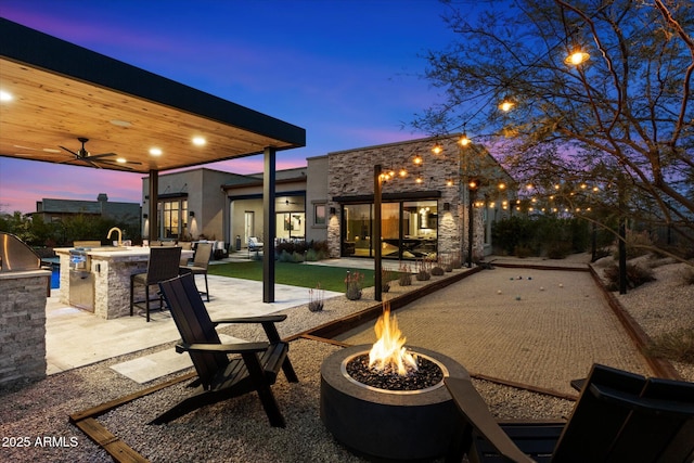 26690 N 119th St, Scottsdale, AZ 85262 - view of patio / terrace featuring exterior kitchen, area for grilling, ceiling fan, outdoor dry bar, and a fire pit