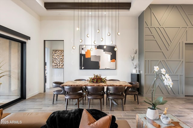 26690 N 119th St, Scottsdale, AZ 85262 - dining space featuring wood tiled floor, a high ceiling, baseboards, and a raised ceiling