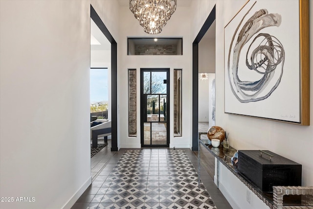 26690 N 119th St, Scottsdale, AZ 85262 - entrance foyer with baseboards and a notable chandelier