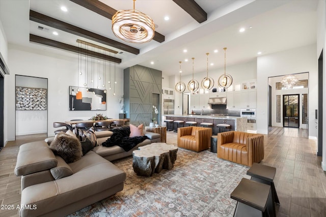 26690 N 119th St, Scottsdale, AZ 85262 - living room featuring a towering ceiling, recessed lighting, light wood-type flooring, and beam ceiling