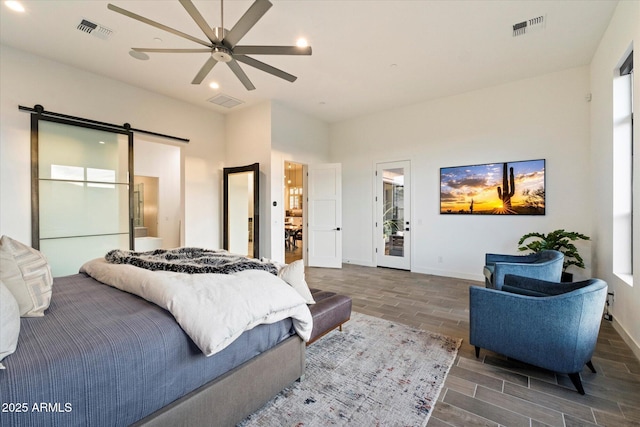 26690 N 119th St, Scottsdale, AZ 85262 - bedroom with baseboards, a barn door, visible vents, and recessed lighting