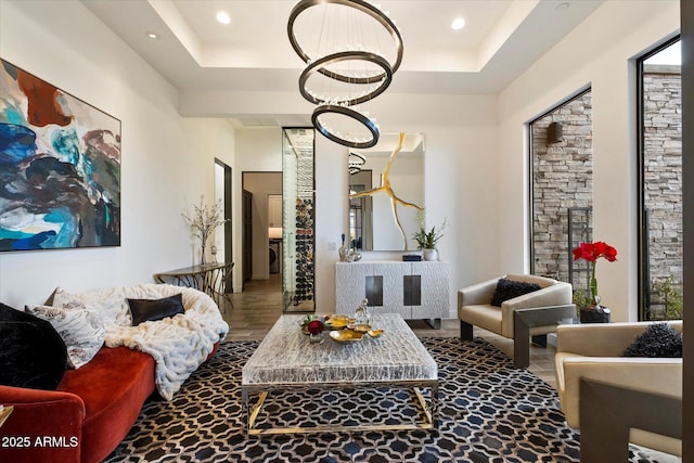 26690 N 119th St, Scottsdale, AZ 85262 - living area with an inviting chandelier, a raised ceiling, wood finished floors, and recessed lighting