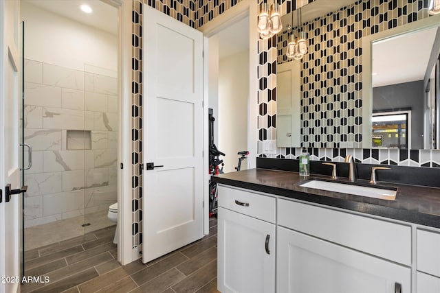 26690 N 119th St, Scottsdale, AZ 85262 - full bath featuring a stall shower, toilet, backsplash, vanity, and wood finish floors