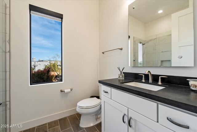 26690 N 119th St, Scottsdale, AZ 85262 - full bath with vanity, toilet, a shower with door, baseboards, and wood tiled floor