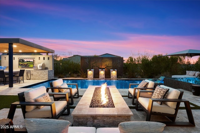 26690 N 119th St, Scottsdale, AZ 85262 - pool featuring an outdoor living space with a fire pit, an outdoor kitchen, and a patio area
