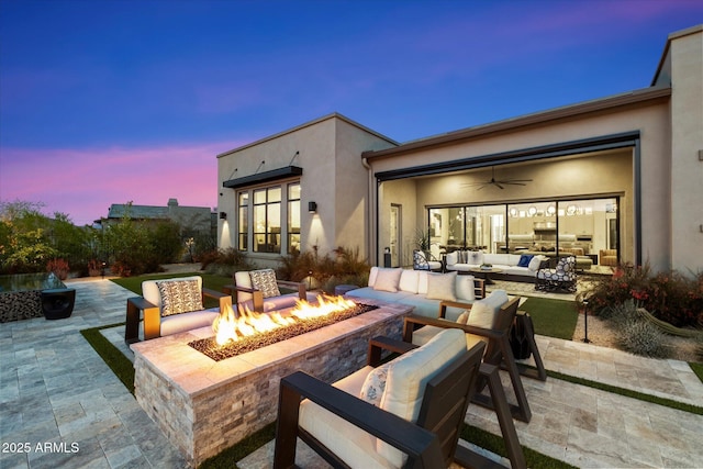 26690 N 119th St, Scottsdale, AZ 85262 - patio terrace at dusk with ceiling fan and an outdoor living space with a fire pit