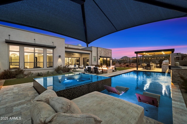 26690 N 119th St, Scottsdale, AZ 85262 - view of pool with an infinity pool, a patio, outdoor dining space, an outdoor kitchen, and an outdoor living space with a fireplace
