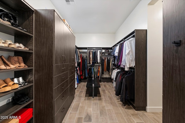 26690 N 119th St, Scottsdale, AZ 85262 - walk in closet featuring visible vents and wood finish floors