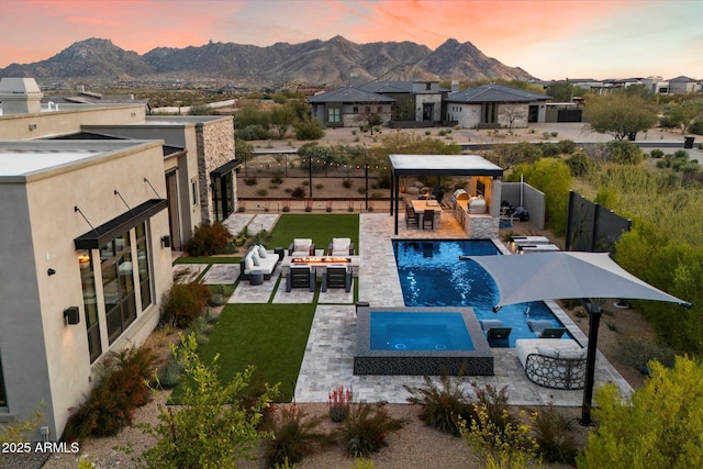 26690 N 119th St, Scottsdale, AZ 85262 - pool at dusk with a fenced backyard, a gazebo, a mountain view, outdoor lounge area, and a patio area