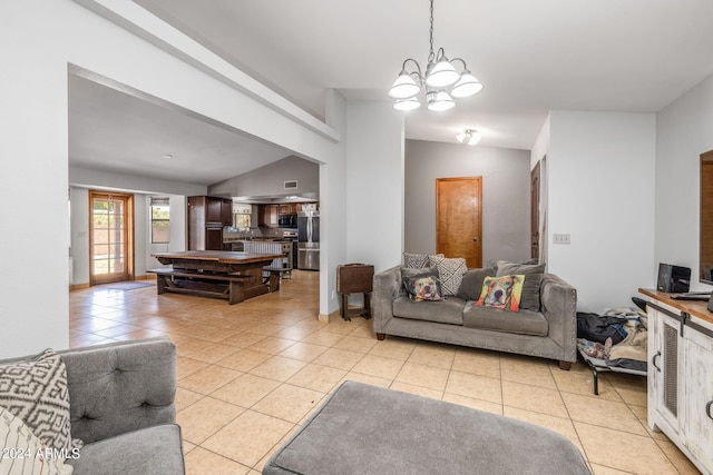 tiled living room featuring a chandelier and lofted ceiling