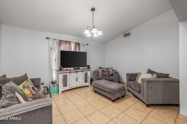 living room with light tile patterned flooring, lofted ceiling, and a notable chandelier