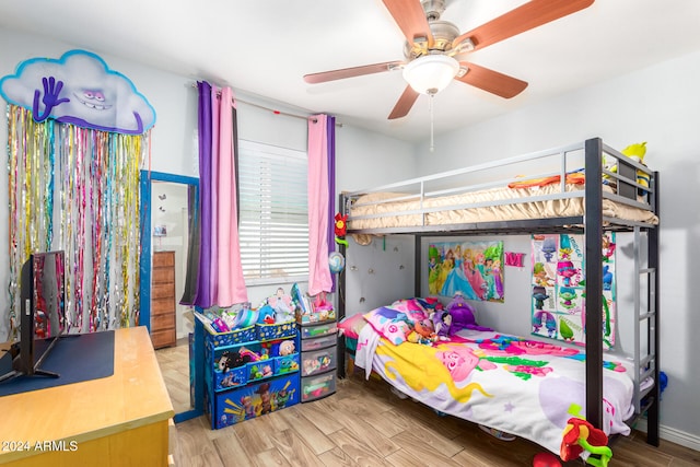 bedroom with hardwood / wood-style floors and ceiling fan