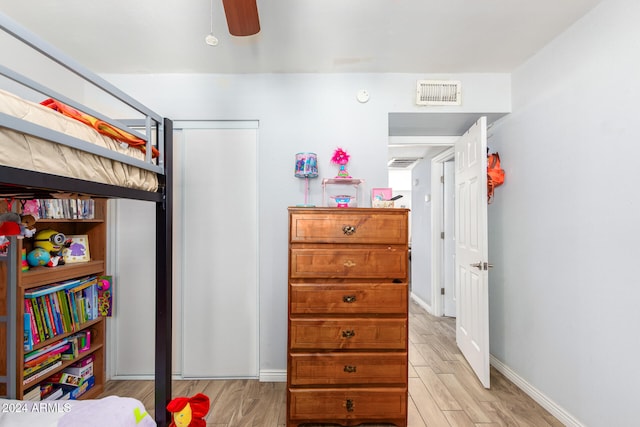 bedroom featuring light wood-type flooring and ceiling fan