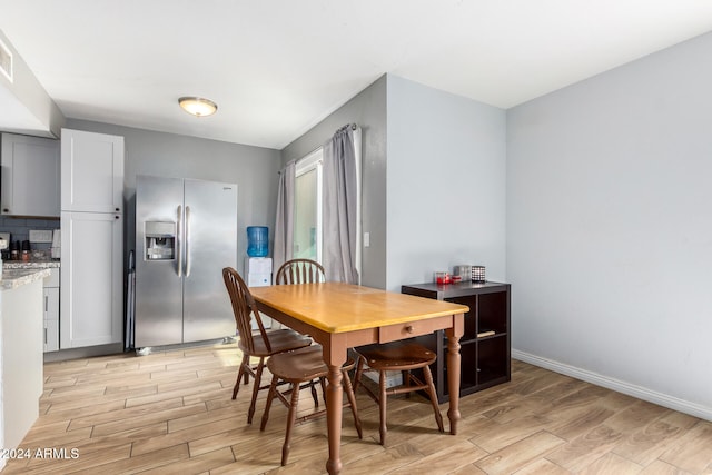 dining space featuring light hardwood / wood-style floors