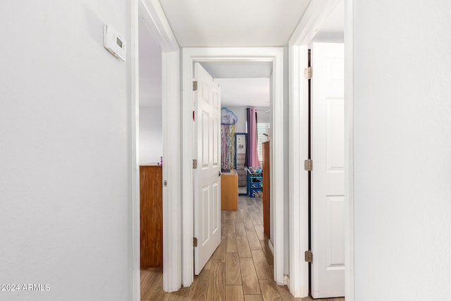 hallway featuring light hardwood / wood-style flooring