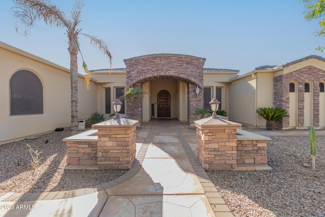 mediterranean / spanish-style house with stucco siding