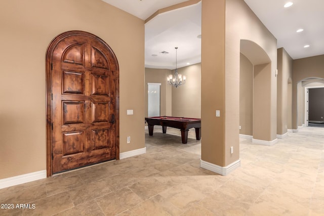 interior space with arched walkways, recessed lighting, billiards, and baseboards